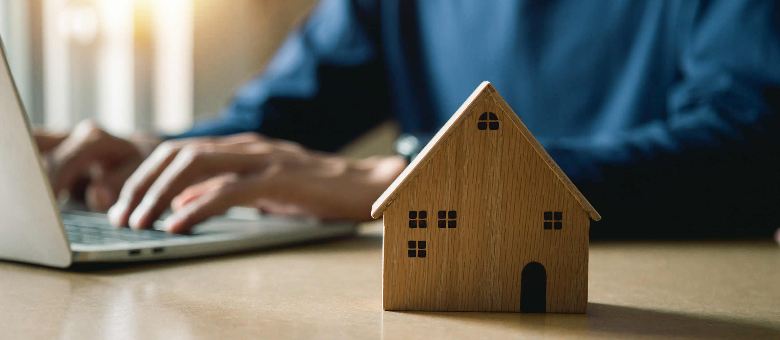Business hand holding home with Buy or Rent, copy space. Propert Business hand holding home with Buy or Rent, copy space. Property investment and house mortgage financial concept, Hand putting money coin stack with wooden house.